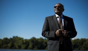 Image: Robert Bullard, black man standing in suit with blue sky in background. Topic: 8 Black Leaders Who've Revolutionized the Climate Movement