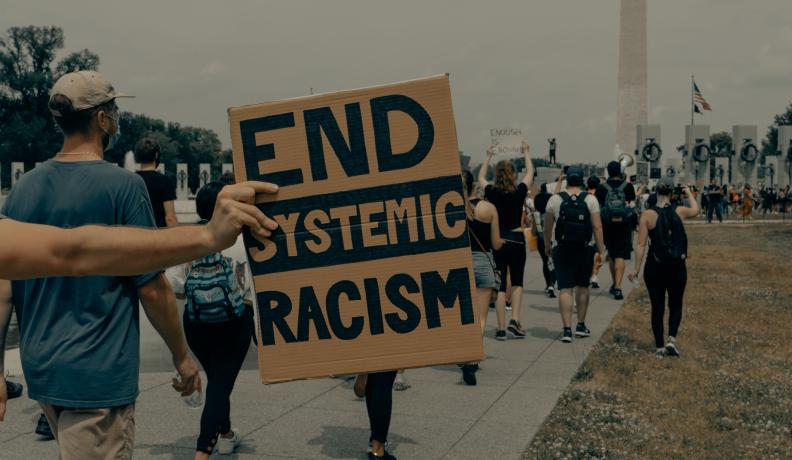 People march towards the Washington Monument at the Black Lives Matter protest in Washington DC