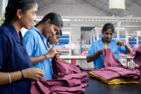 Image: women working with textiles. Title: In Search of Ethical Fashion