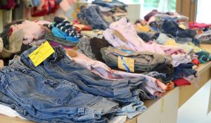 Image: piles of secondhand clothing on sale