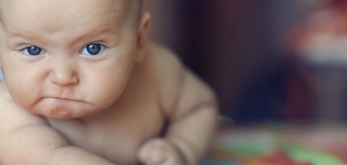 Image: baby looking grumpy. Topic: Carter's: End Toxic Textiles in Children's Clothing