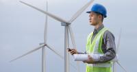 Image of a worker on a wind farm 