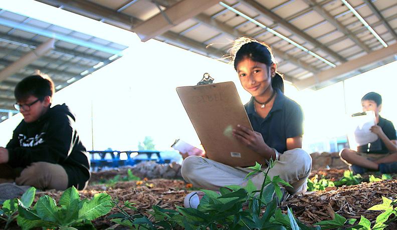 girl working at Arizona garden