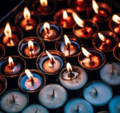 Image: tea lights burning. Topic: Most Popular Green Living Tips