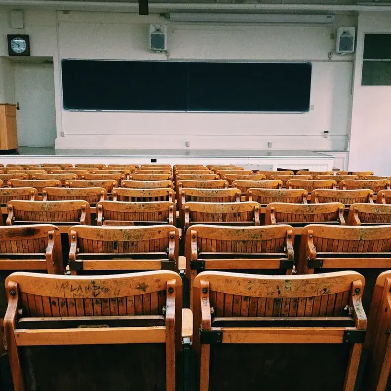 Image: classroom with empty seats. Topic: Greening School Fundraisers