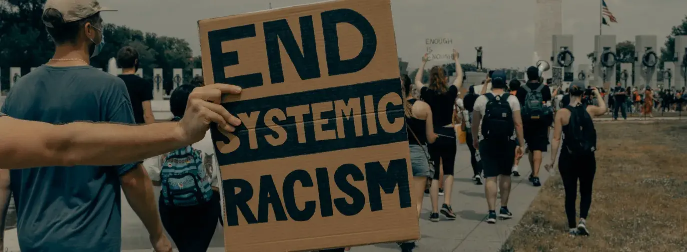 People march towards the Washington Monument at the Black Lives Matter protest in Washington DC