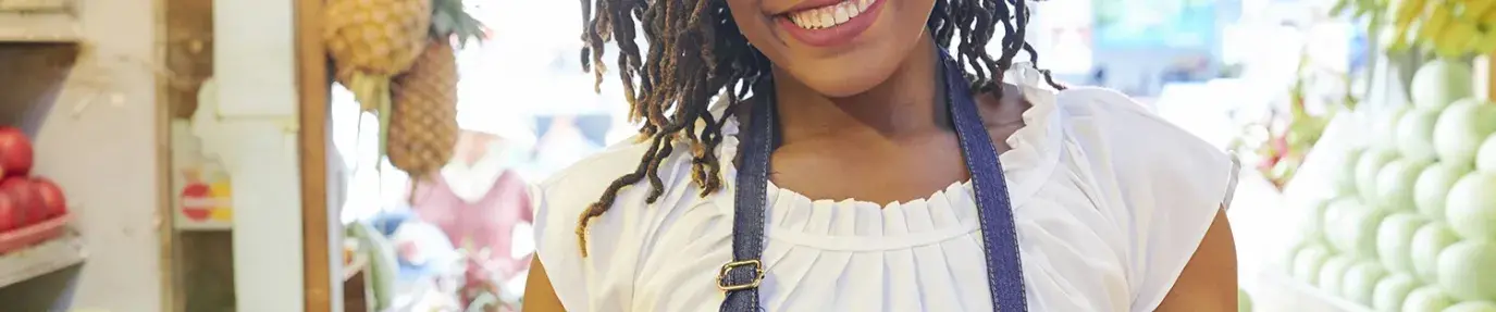 Image: woman with food. Title: Essential agriculture workers need our support during COVID-19