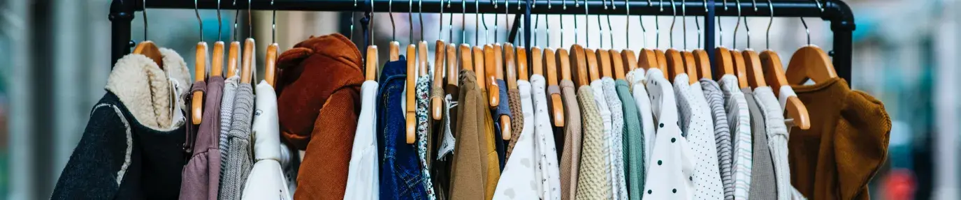 Image: children's clothing hanging. Title: Toxic Textiles Update: Carter’s First Sustainability Report
