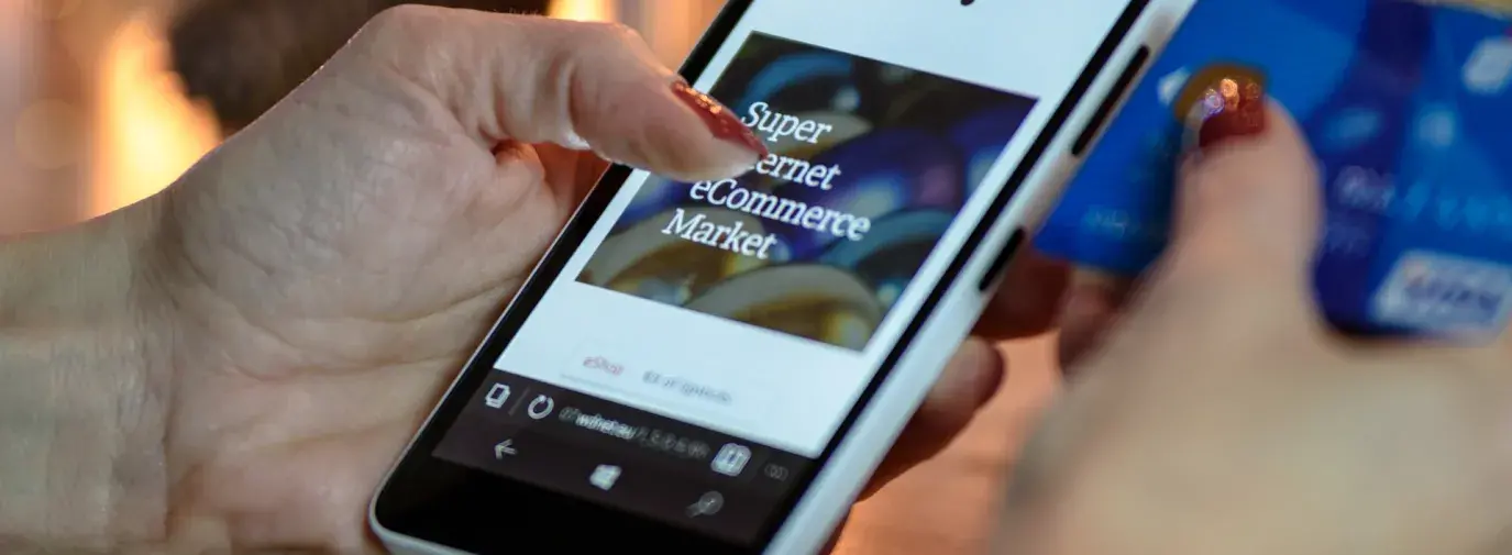 Hands holding smartphone shopping online. 