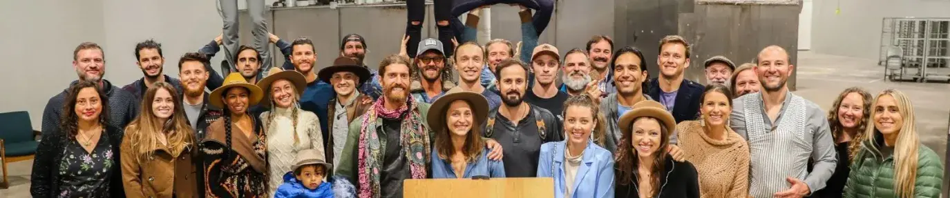 workers at Pacha factory standing together and smiling at the camera in celebration of achieving the Soil Climate Health Intiative label.