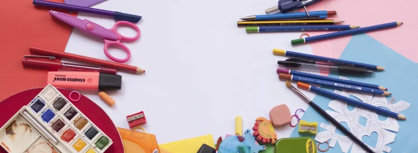 Image: colorful art supplies laid out on table. Topic: Are Your Art Supplies Toxic?