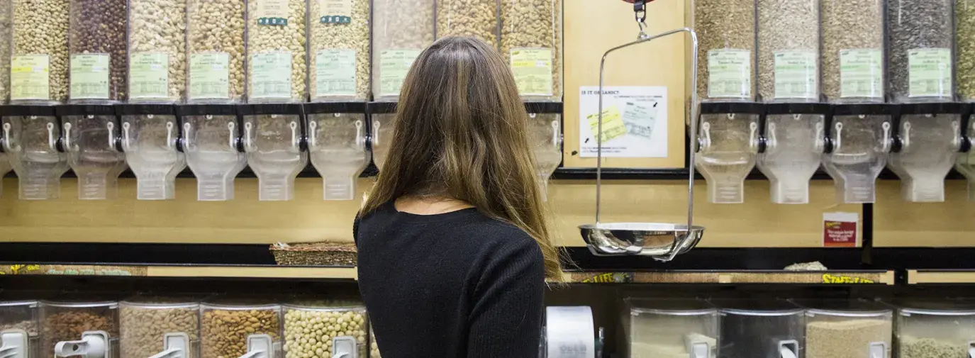 woman shopping in the bulk aisle