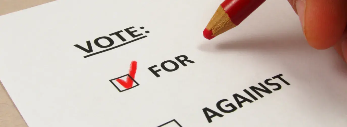 Image: a ballot voting yes. Topic: Shareholders Tell Walmart to Address its Polluting Refrigerants