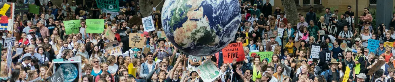 Image: climate protest. Text: COP 26 Progress, But Not Nearly Enough