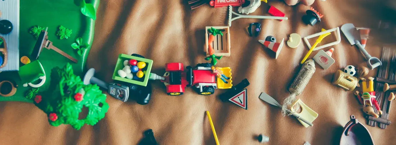 Image: toys scattered on couch. Topic: Beyond Lead: Toxins in Toys