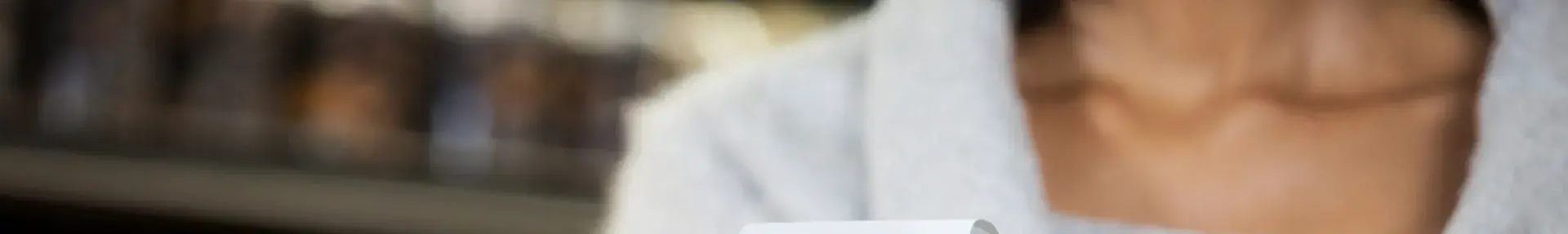 Image: woman holding paper receipt Topic: Skip the Slip to reduce store receipts